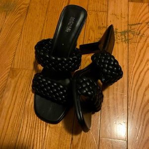 I am selling a pair of all black Michael Kor  2 inch heels, they are a size 8